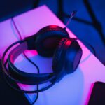 black and red corded headphones on white table